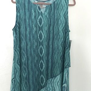 Never worn.  Light summer sleeveless tunic. Nice accent at neck. Drapes nice.